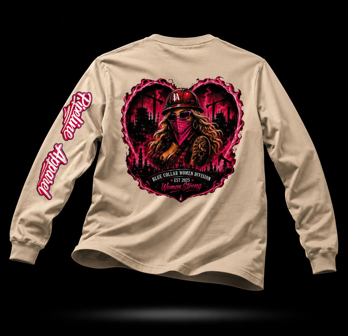Beige long sleeve shirt featuring a pink heart-shaped graphic of a woman in a hard hat and industrial background.
